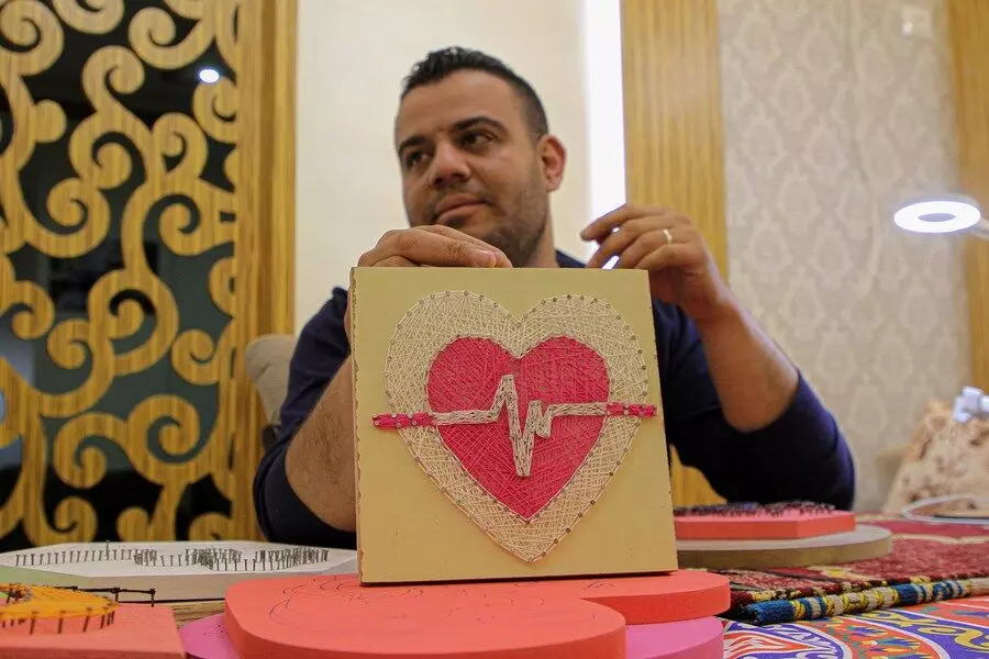 Unemployed Palestinian makes living from using nails, coloured threads for art