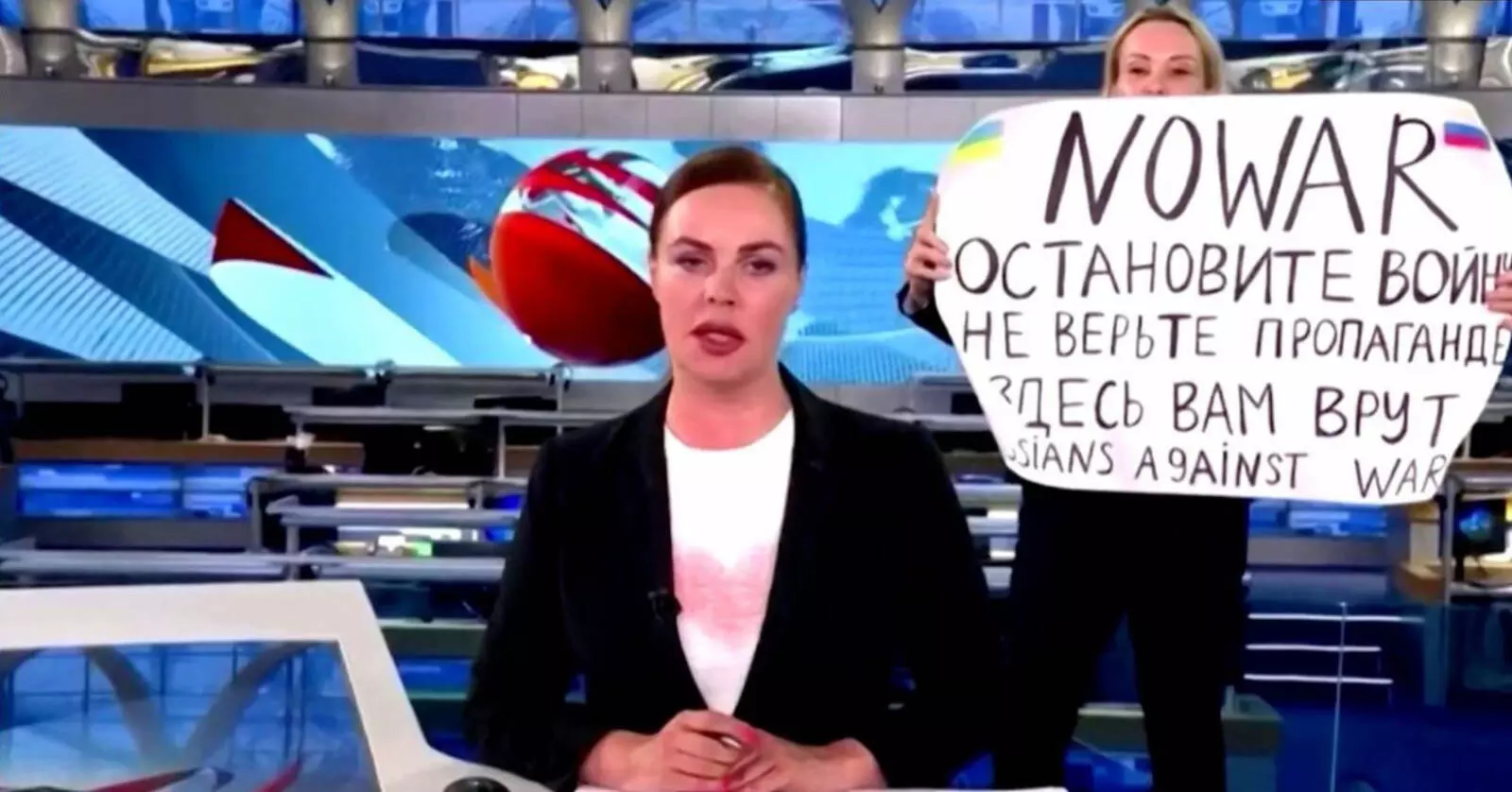 Russian journalist detained for interrupting live broadcast Russian journalist detained for interrupting live broadcast