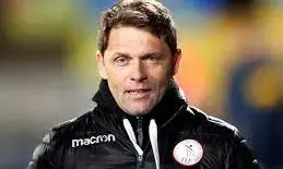 Football can be trauma medicine after fleeing war, coach tells players