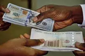 Naira gains marginally against dollar, exchanges at 419