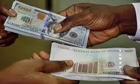 Naira gains marginally against dollar, exchanges at 419