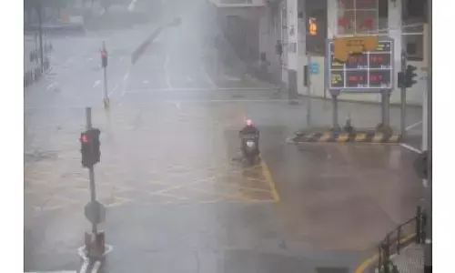 China raises alert level as heavy rain approaches