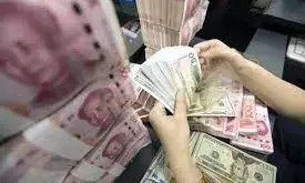 Chinese Yuan weakens to 7.0298 against dollar