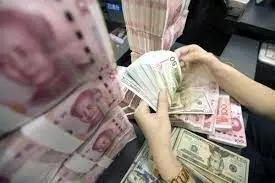 Chinese Yuan weakens to 7.0298 against dollar