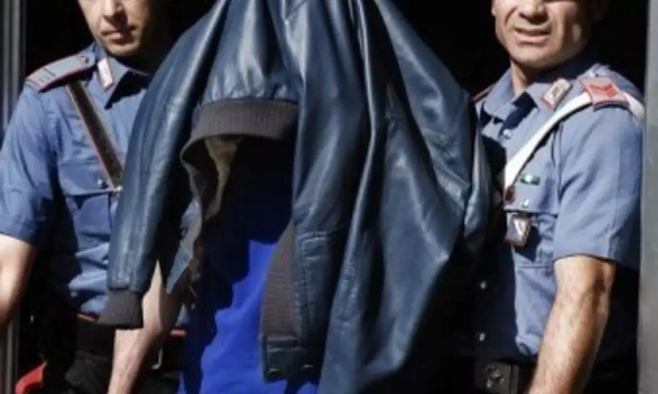 Italian police arrest more than 30 in raids