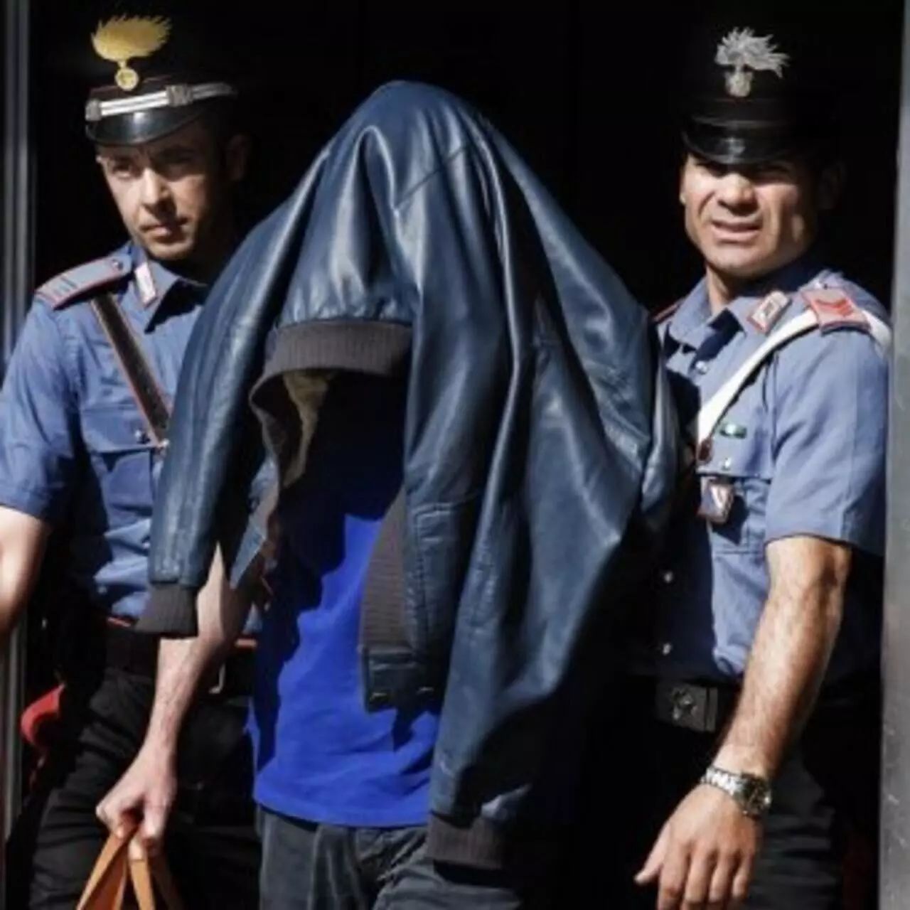 Italian police arrest more than 30 in raids