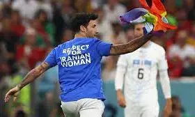 World Cup pitch invader with rainbow flag declares his freedom