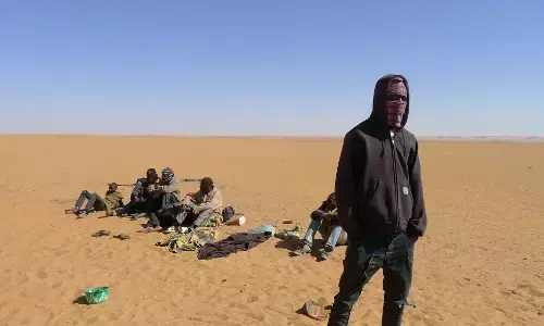 Libyan border guards rescue migrants in desert