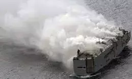 Ship carrying 3,000 cars burns off Dutch coast, crew member dead