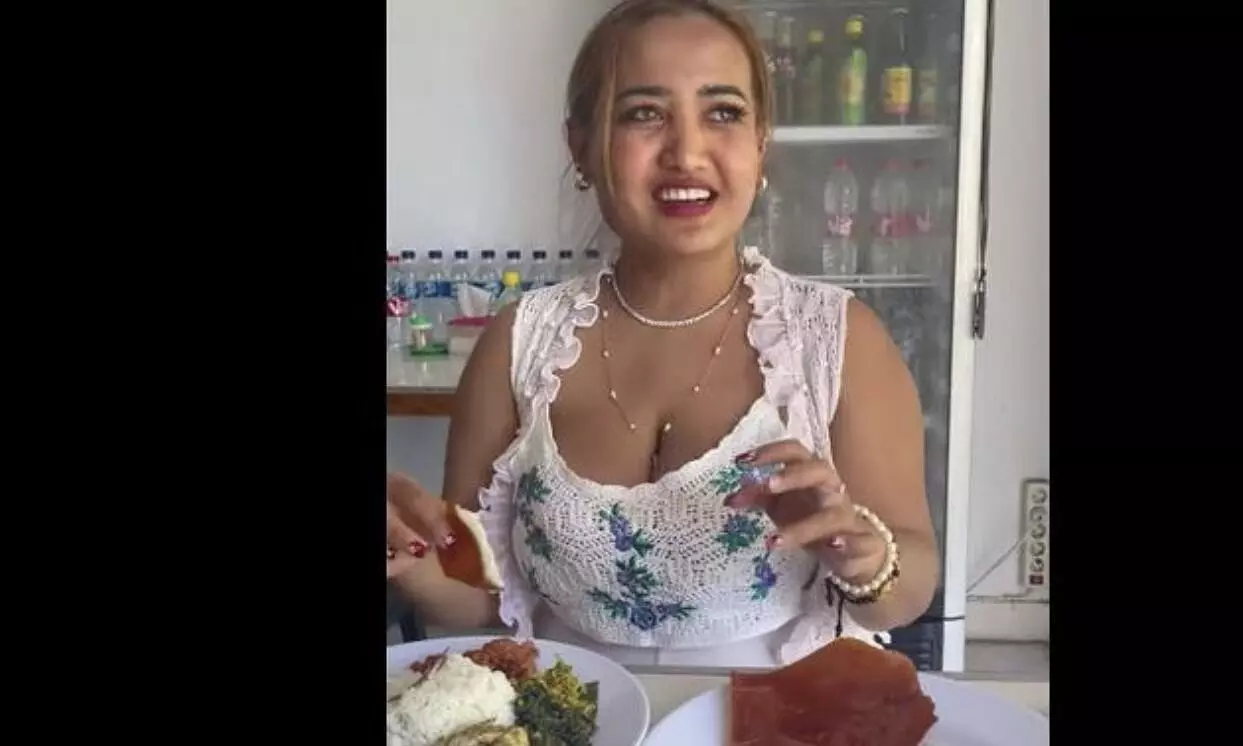 Woman jailed for TikTok video praying before eating pork