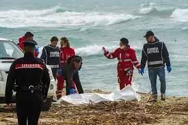 Italy brings 4 boat migrants ashore amid row over teenager’s death