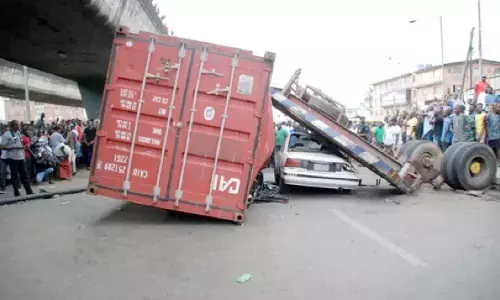 Falling container kills woman inside her car in Lagos traffic