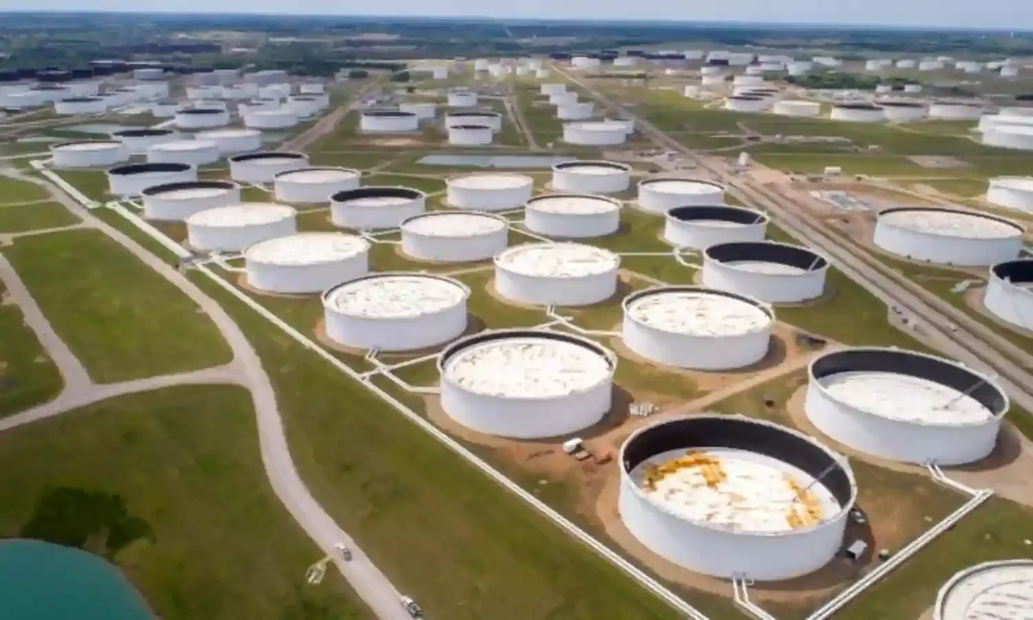 Oil steady after IEA lowers demand forecast, U.S. stocks fall