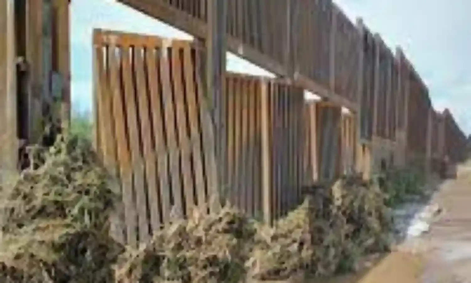 Trump border wall damaged by heavy flooding
