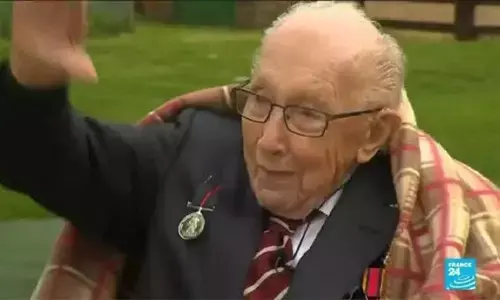 Britain mourns ‘hero’ Captain Tom Moore with flowers, lights