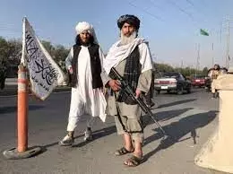 Some Kabul residents venture past gun-toting Taliban back to work